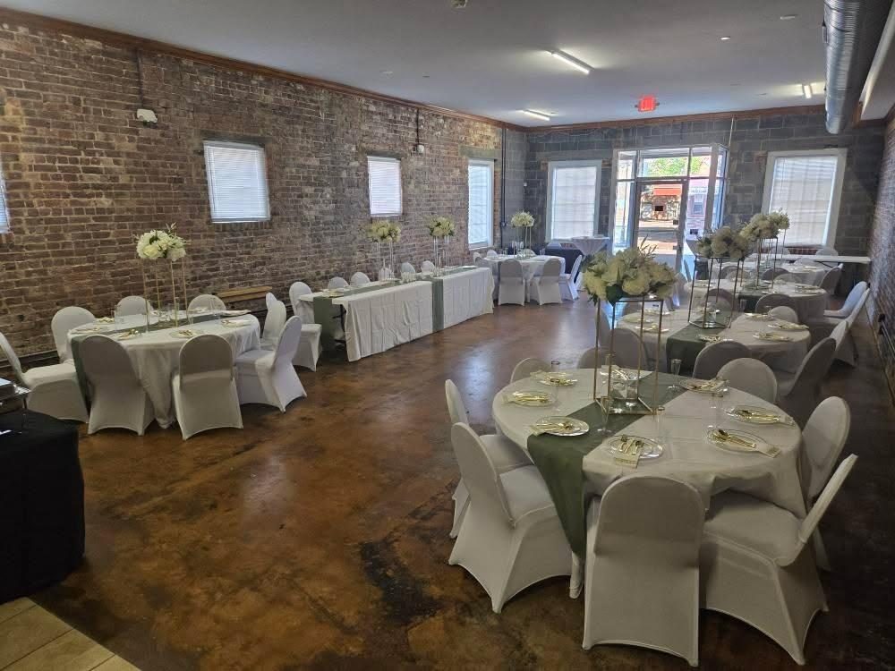Set for a reception, round tables and florals